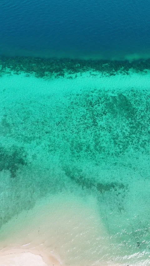 Vertical drone over multishade blue water and white sand, Koh Ngai – 4K Video stock 325022373