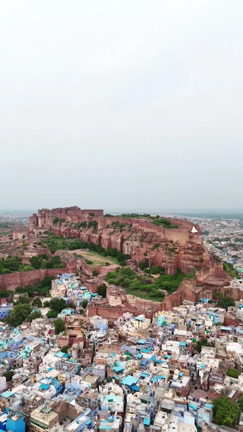 Vertical drone pan up revealing full Mehrangarh structure Stock Footage 310660509