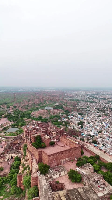 Vertical drone pan up revealing full Mehrangarh structure Stock Footage 310660824