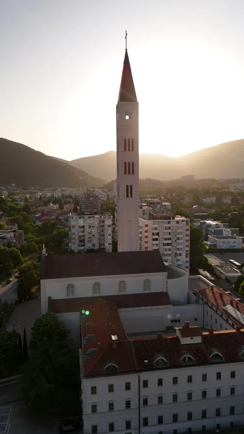 Vertical Drone Parallax of Mostar Peace Bell Tower Church Golden Hour 4K Vídeo Stock 337831247