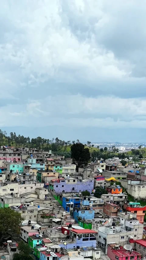 Vertical drone pass over dense Toluca neighborhoods, Mexico Stock Footage 348588001