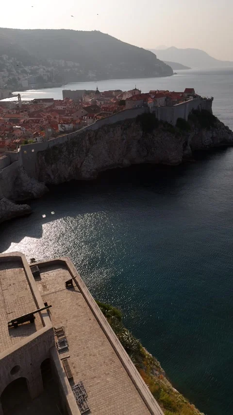 Vertical Drone Pull Back From Dubrovnik Fort Lovrijenac to Old Town Birds 4K Stock Footage 337848676