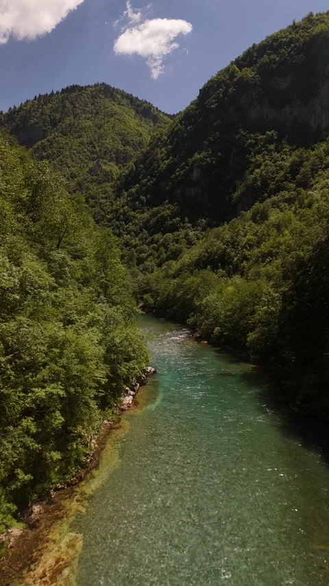 Vertical Drone Push over Pristine River Rapids in Deep Mountain Gorge, 4K Stock Footage 337180266