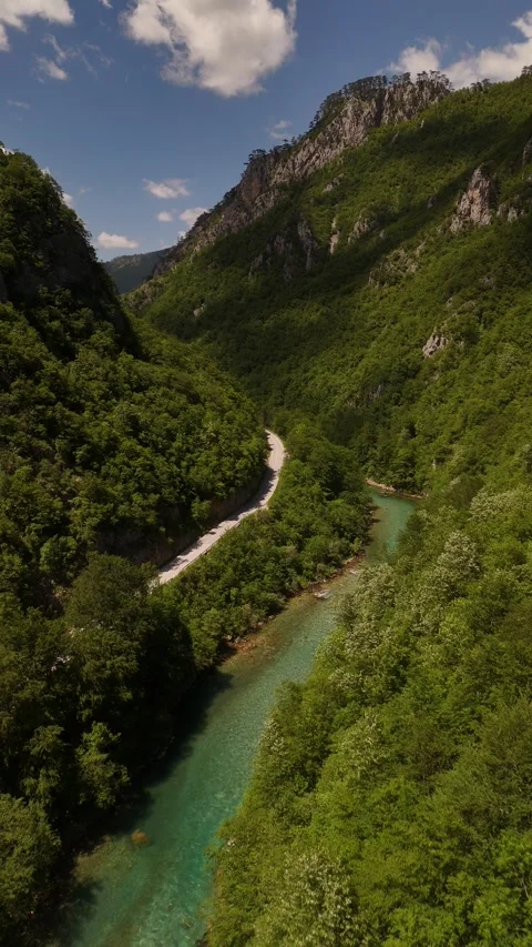 Vertical Drone Push over Tara River and Remote Mountain Canyon Road, 4K Stock Footage 337180272