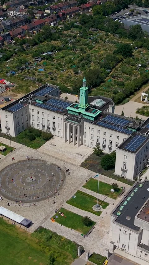 Vertical drone reverse rise over Waltham Forest council offices and Fellowship Stock-Footage 340159110