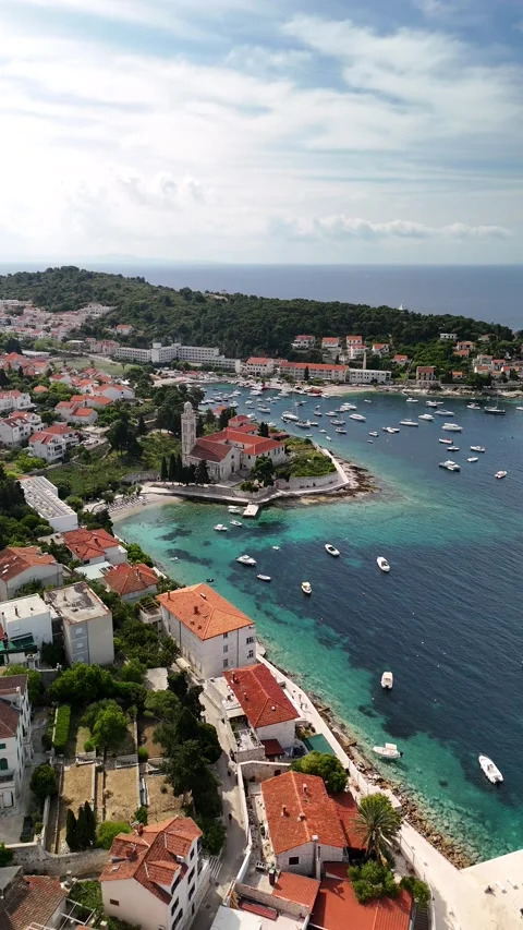 Vertical Drone Semicircle: Hvar Coastline, Beaches &amp; Football Field, Croatia Video stock 313483667