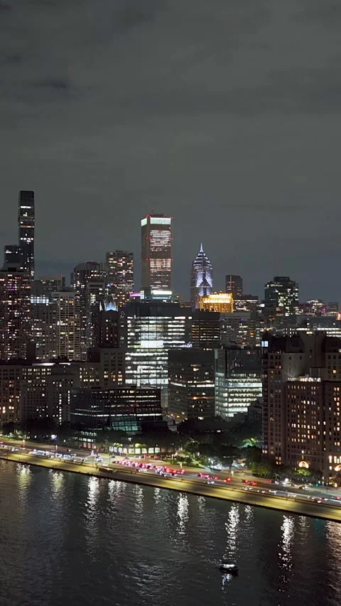 Vertical drone shot approaching the skyline from Lake Michigan, night in Chicago Stock Footage 324697875