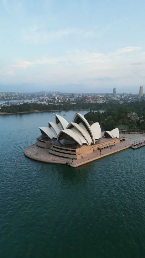 Vertical drone shot approaching the Sydney Opera House, sunset in Australia Stock Footage 345831710