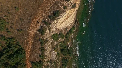 Vertical drone shot away from a cliff on Lake Garda Stock-Footage 129194008