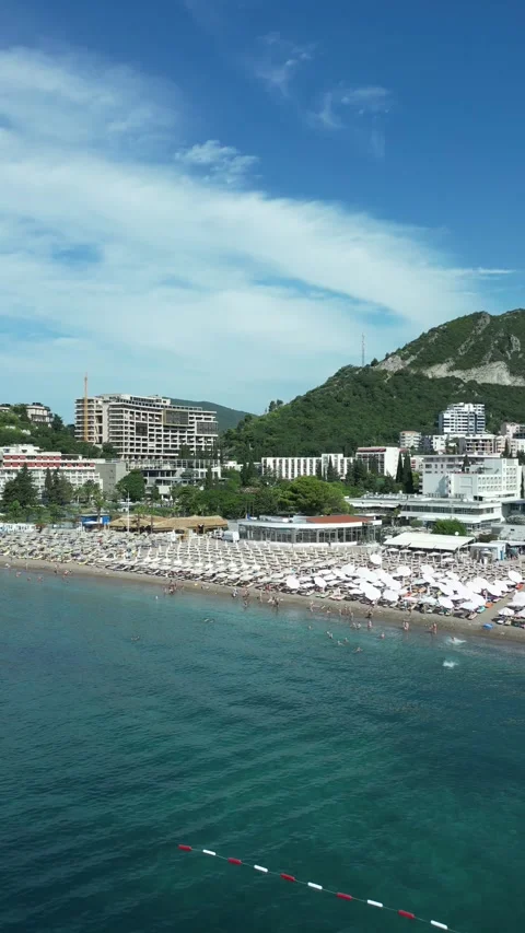 Vertical drone shot of Becici Beach and coastline in Montenegro Stock Footage 338026782