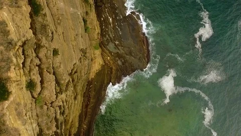 Vertical drone shot of the Cape Bridgewater cliffs. Stock Footage 87257909