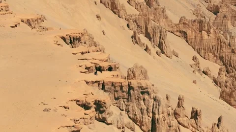 Vertical drone shot capturing the epic moment of a motorcyclist overlooking the Stock Footage 310898941