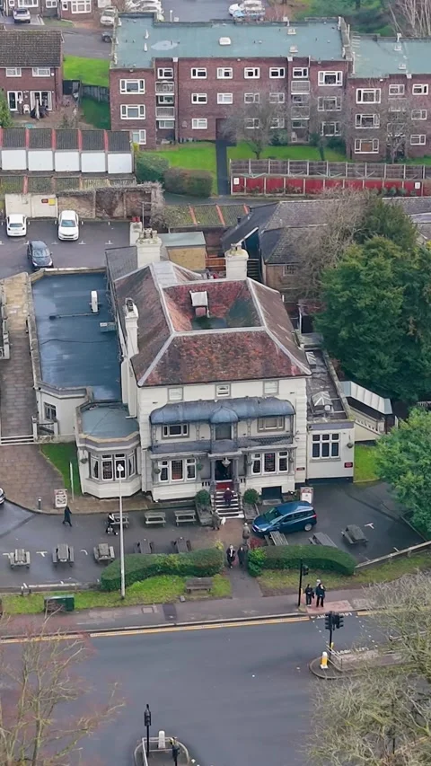 Vertical drone shot of historic Eagle pub, now Toby Carvery, Snaresbrook Stock Footage 327904677
