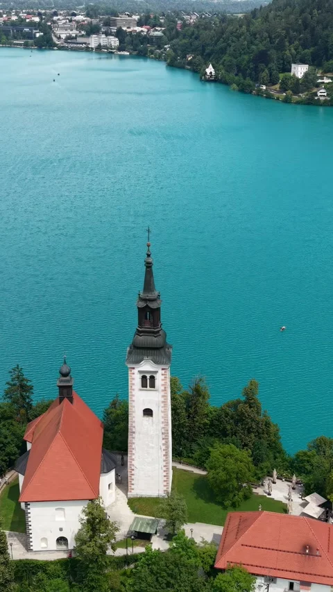 Vertical Drone Shot of Lake Bled and Virgin Mary Catholic Church on Small Island Stock Footage 346357246