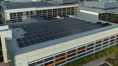 Vertical drone shot of large solar panel array on corporate building. Stock Footage 93096753