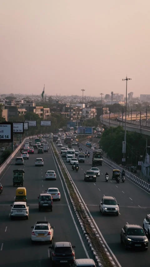 Vertical drone shot of multiple Delhi flyovers with traffic flow Stock Footage 319074625