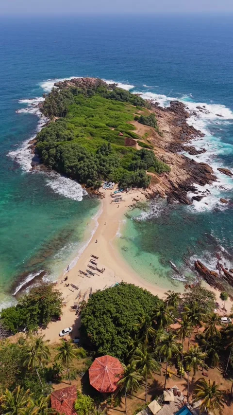 Vertical drone shot over blue beach Sri Lanka Stock Footage 331026665