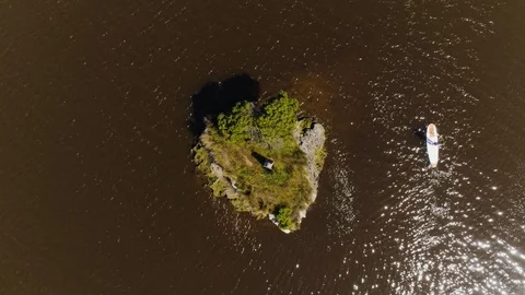 Vertical drone shot of paddle boarder in Glenelg River, Nelson, Australia. Stock Footage 87254013
