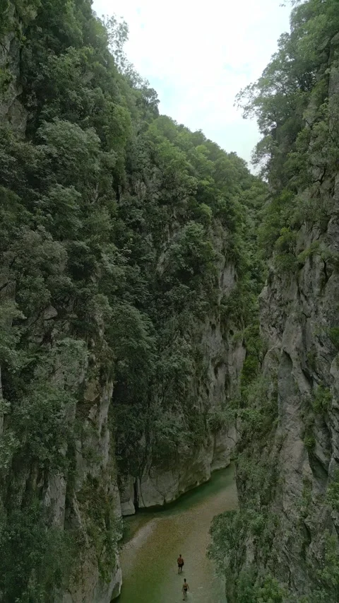Vertical drone shot pulling back through the majestic Acheron river gorge Stock-Footage 347440999