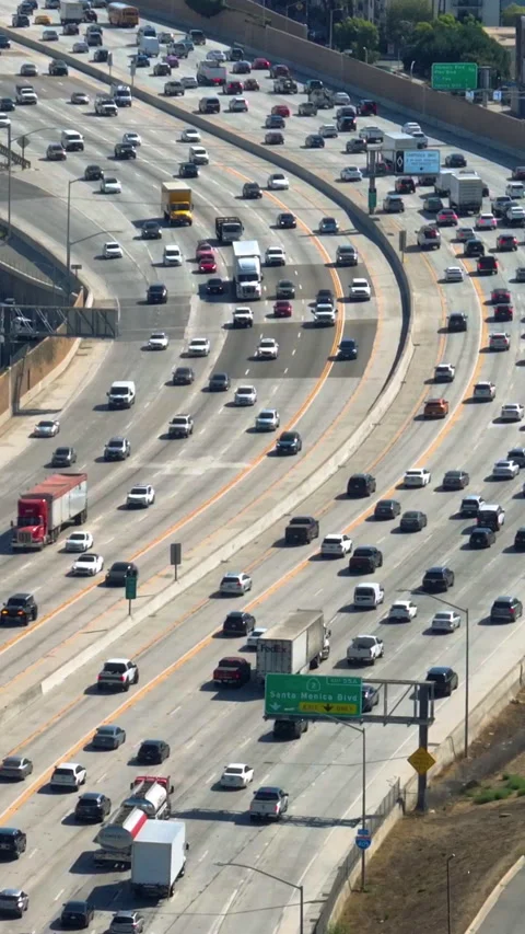 Vertical drone shot of rush hour traffic on interstate 405, in sunny Los Angeles Stock Footage 293762323