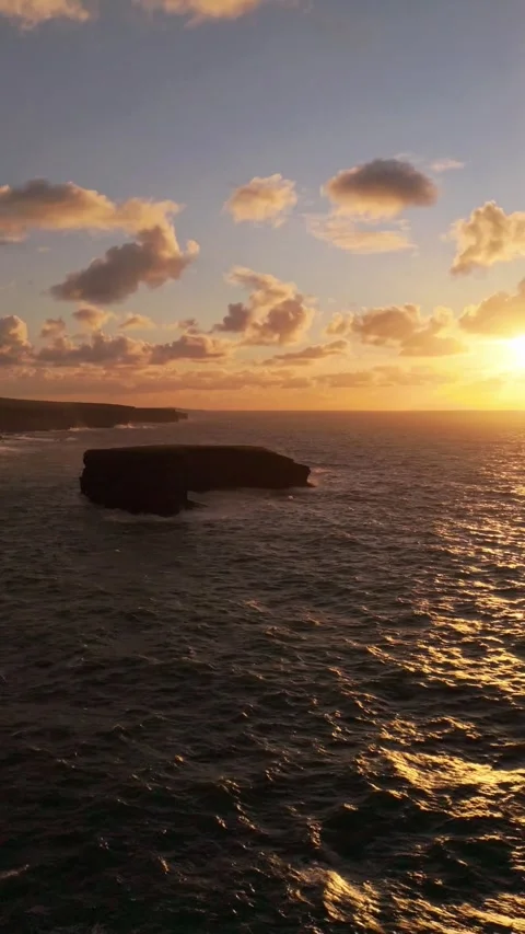 Vertical Drone Shot, Sunset Over Atlantic Ocean and Coastline of Loop Head Stock Footage 345117045