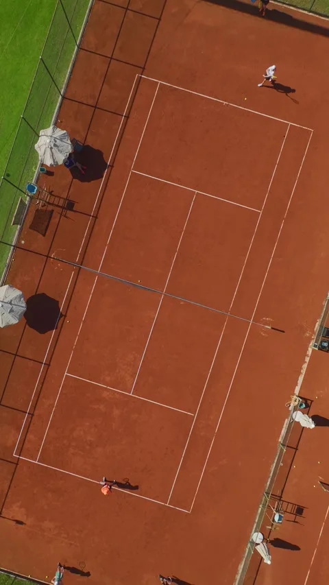 Vertical Drone Shot Tennis Training Camp Atmosphere with Multiple Participants Video stock 341792753