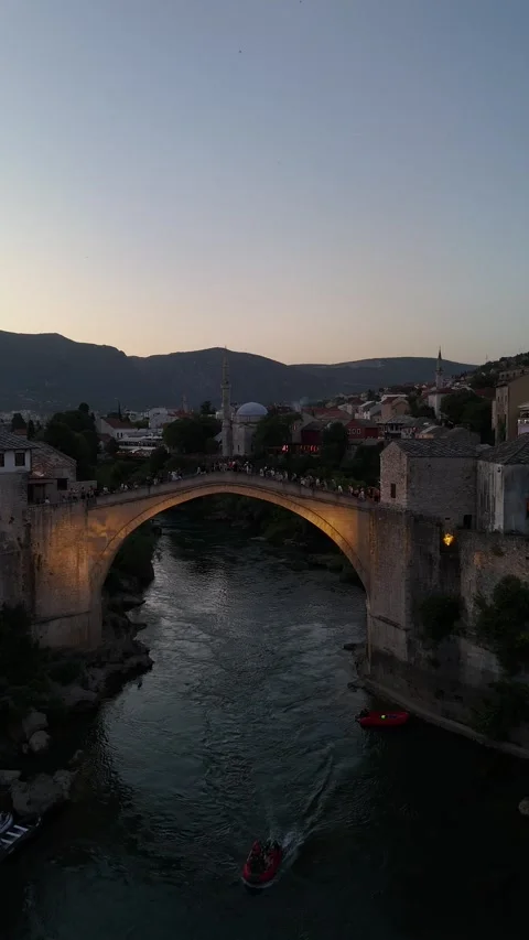 Vertical Drone Slow Reverse Parallax Past Stari Most Old Bridge at Dusk 4K 動画素材 337830923