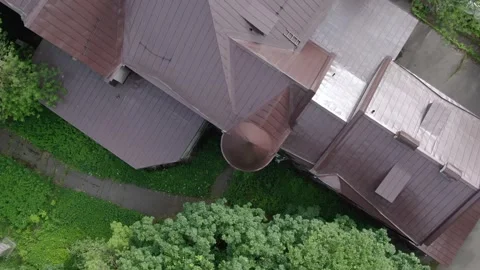 Vertical drone spin over residential building roof Video stock 332735752
