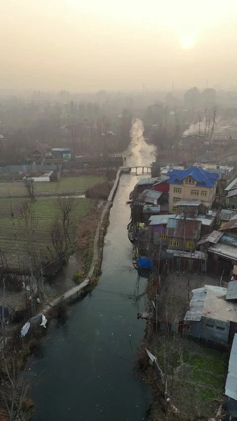 Vertical drone story of Srinagar’s Dal Lake, frozen solid and glowing under the Stock Footage 311020355
