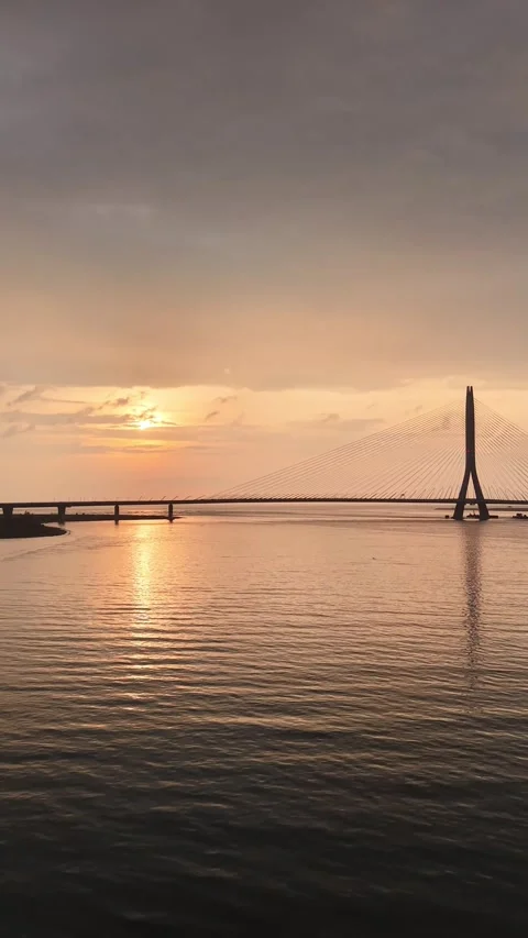 Vertical Drone Sunset over Tamsui River and Danjiang Bridge, Taiwan Stock Footage 343077133