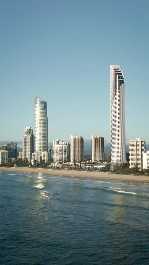 Vertical drone Surfers Paradise beach centre waves rolling iconic Q1 building Vídeo Stock 328991208