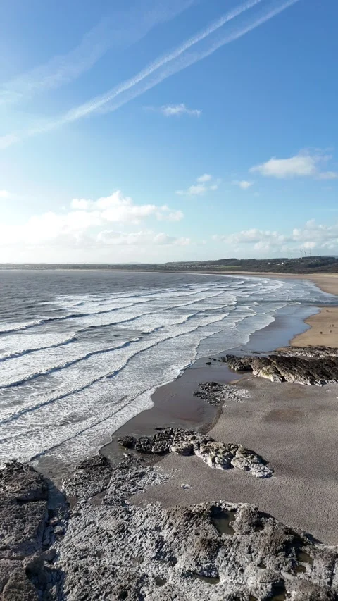Vertical Drone Tracking Backwards Over Ocean Waves, UK 4K Stock-Footage 334071465