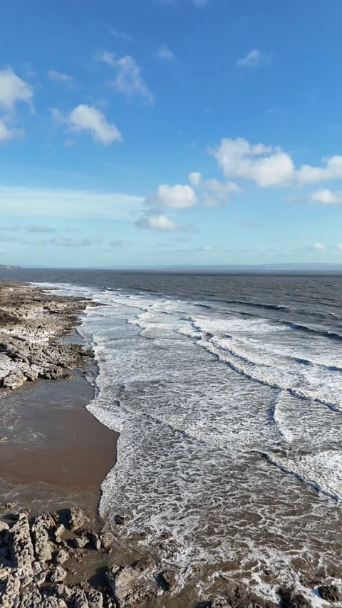 Vertical Drone Tracking Forward Over Rocks and Ocean Waves 4K Stock-Footage 334068784