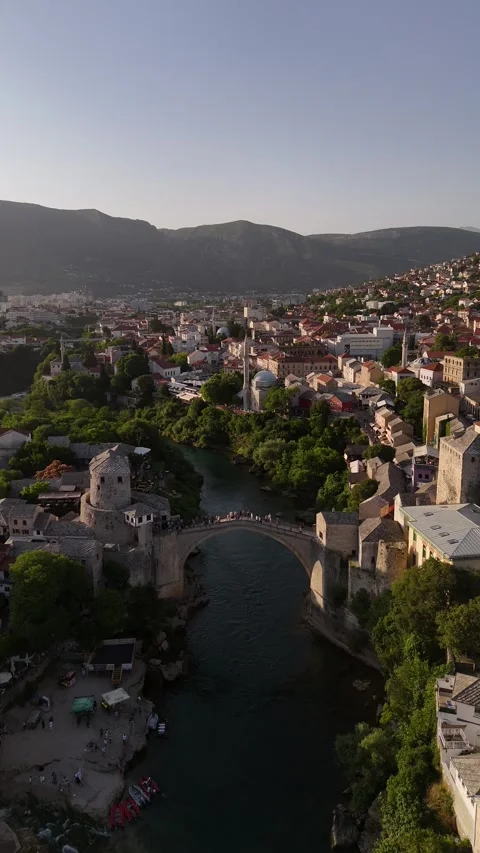 Vertical Drone Tracking Shot Neretva River to Mostar Old Bridge Golden Hour 4K Vídeo Stock 337831044