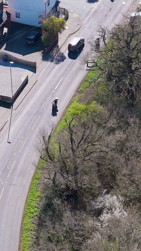 Vertical drone tracking van driving London road, Hertford Heath village Vídeo Stock 332619750