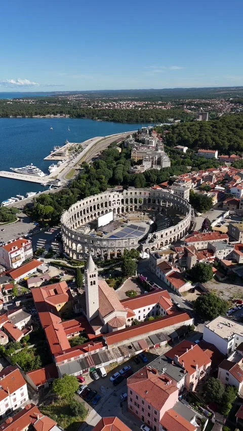Vertical drone video of ancient city with central amphitheater Stock Footage 323503985