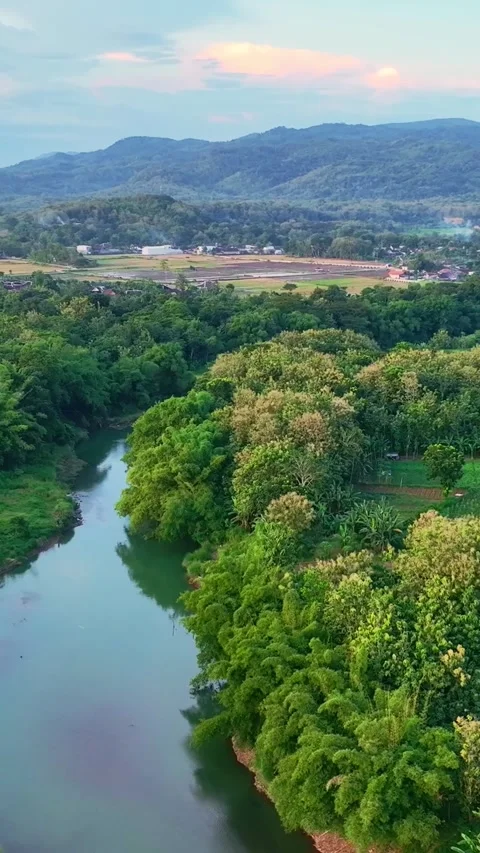 Vertical drone video of calm river and hills Stock Footage 336316539