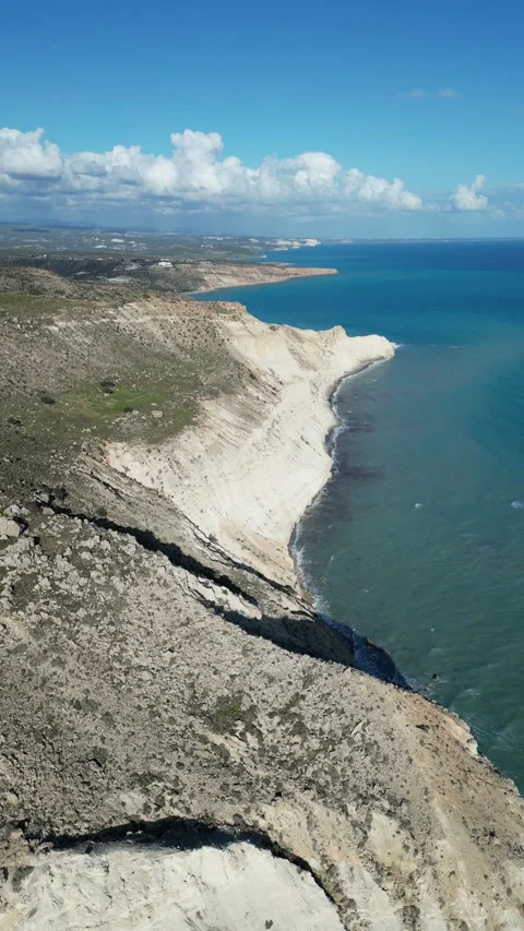 Vertical drone video. Flying above the cliff and the sea Stock Footage 236942549