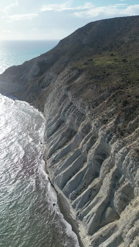 Vertical drone video. Flying from the cliff and above the sea Stock Footage 236868852