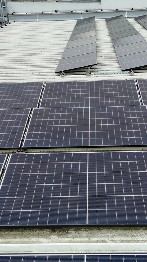 Vertical Drone Video Flying Forward Over Solar Panels On Industrial Roof Stock Footage 330750936