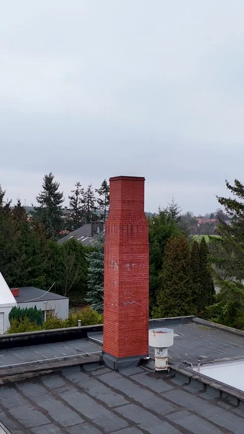 Vertical Drone Video Flying Towards Red Brick Chimney Over Flat Roof Stock Footage 330751066