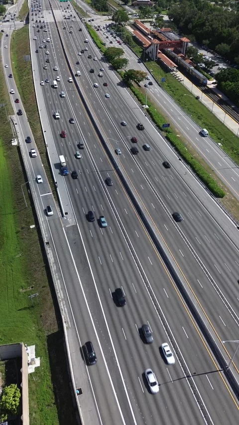 Vertical Drone Video of Highway Traffic and Greenery, Florida Stock Footage 340522146