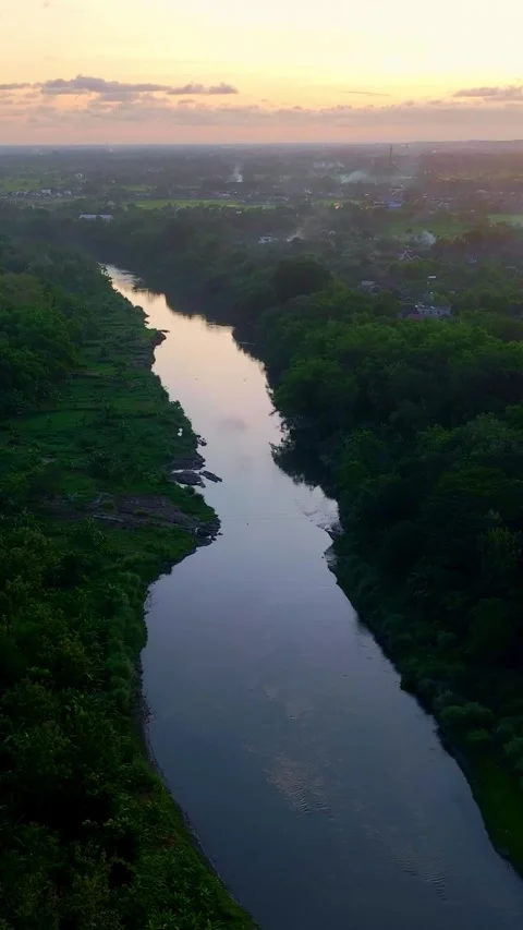 Vertical drone video of reflective sunset river Stock Footage 336316592