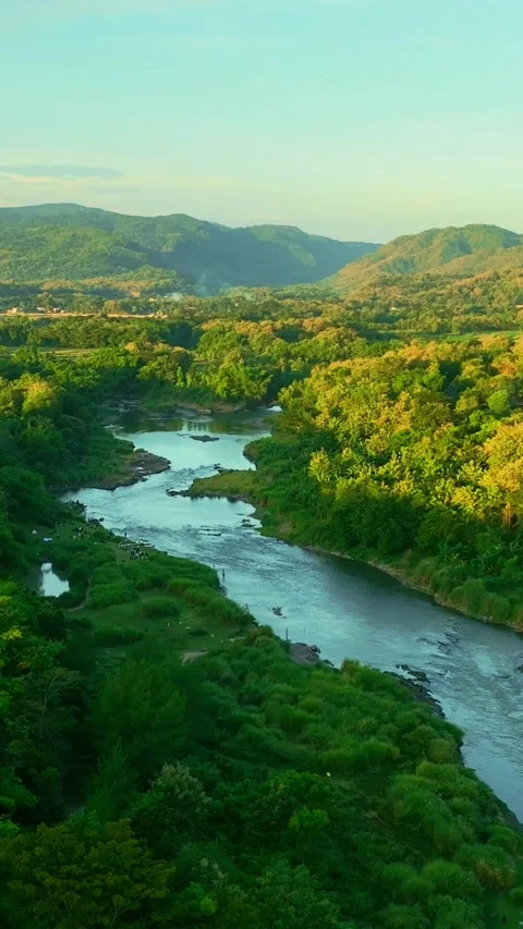 Vertical drone video of river through hills Stock Footage 336316337