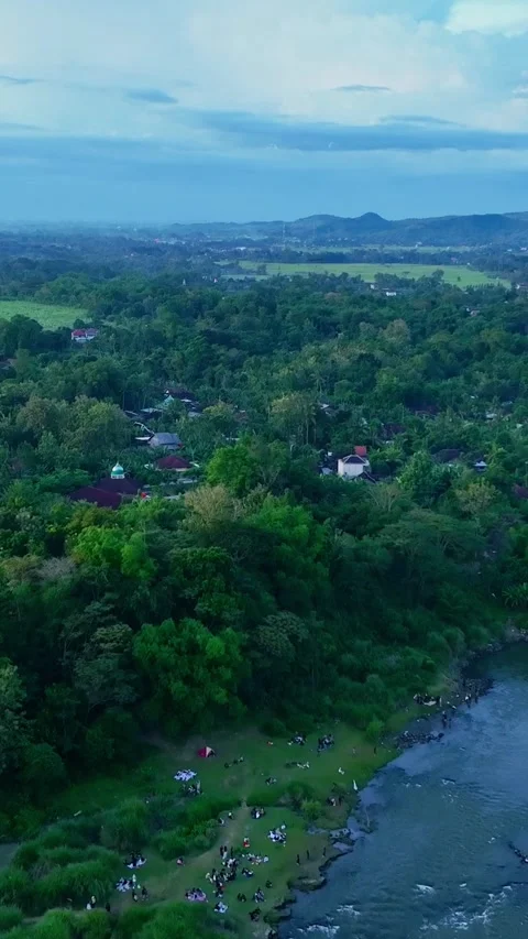 Vertical drone video of riverside village landscape Stock Footage 336316708