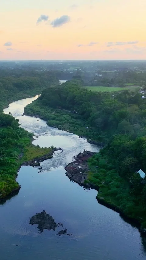 Vertical drone video of sunset river valley Stock Footage 336316589