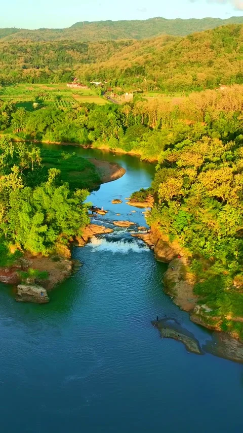 Vertical drone video of turquoise river valley Stock Footage 336315974