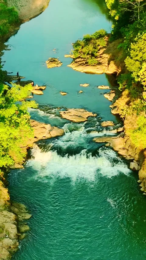 Vertical drone video of turquoise river rapids Stock Footage 336316052