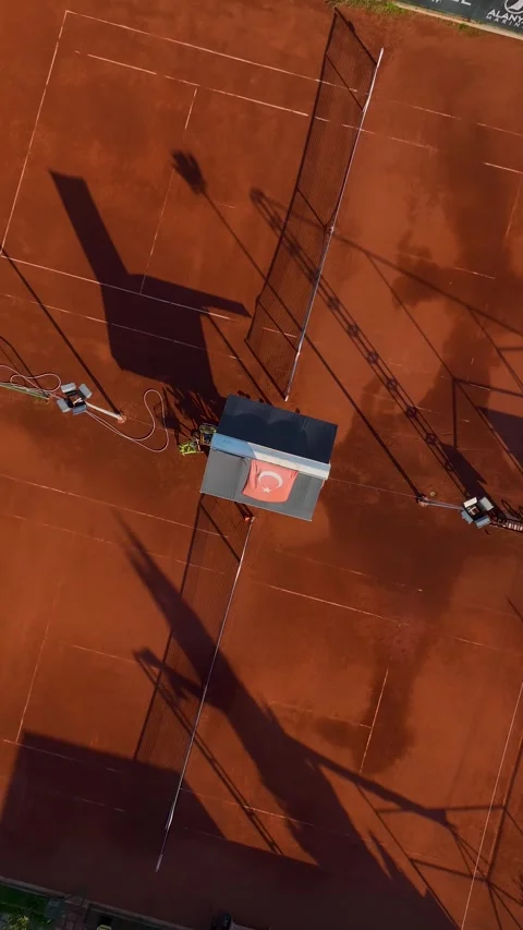 Vertical Drone View Clay Tennis Court with Net, Equipment and Training Stock Footage 341767606