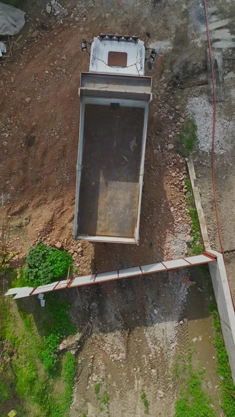 Vertical Drone View Construction Area with Rebar, Concrete Blocks and Workers 스톡 동영상 341732529